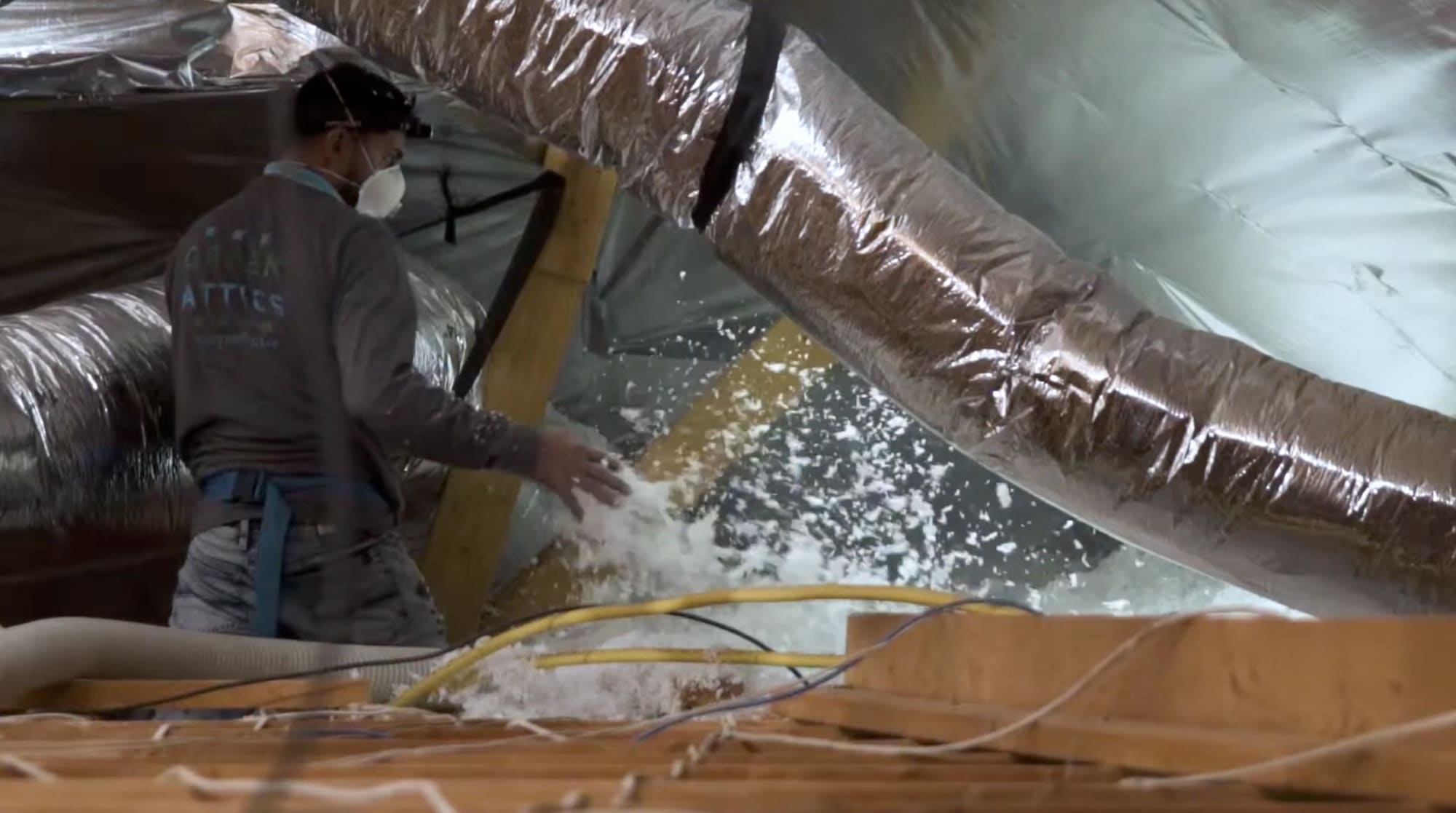 blown in insulation installation to attic with radiant barrier installed